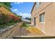 Backyard featuring wood deck and a retaining wall with landscaping at 1037 Sailing Bay Dr, Clermont, FL 34711