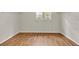 Large walk-in closet with wood floors and a window allowing plenty of natural light at 1037 Sailing Bay Dr, Clermont, FL 34711
