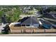 Overhead view of home with fenced backyard, covered patio and screened in pool area at 104 Bentley Oaks Blvd, Auburndale, FL 33823