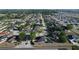 Aerial view of suburban neighborhood featuring well-maintained homes, tree-lined streets, and manicured lawns at 104 Bentley Oaks Blvd, Auburndale, FL 33823