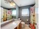 Bathroom with vanity sink, toilet, and shower/tub at 104 Bentley Oaks Blvd, Auburndale, FL 33823