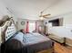 Bedroom with large bed, ceiling fan, and laminate floors at 104 Bentley Oaks Blvd, Auburndale, FL 33823