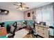 Bedroom with ceiling fan, laminate floors, and exercise equipment at 104 Bentley Oaks Blvd, Auburndale, FL 33823