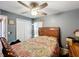 Bedroom with ceiling fan, closet, and natural light at 104 Bentley Oaks Blvd, Auburndale, FL 33823