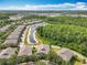 Residential area with a serene community pond surrounded by mature trees and well-maintained landscaping at 10852 Spider Lily Dr # S, Orlando, FL 32832