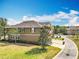 Exterior of a two-story home with a well-maintained lawn and mature trees at 10852 Spider Lily Dr # S, Orlando, FL 32832