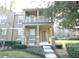 Charming two-story home featuring a porch and second story balcony and beautifully landscaped front yard at 10852 Spider Lily Dr # S, Orlando, FL 32832