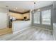 Kitchen and Living Room featuring stainless steel appliances and light wood floors at 10852 Spider Lily Dr # S, Orlando, FL 32832
