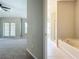 Spacious main bedroom featuring a private bath with separate tub and shower, along with a private balcony at 10852 Spider Lily Dr # S, Orlando, FL 32832