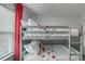 Comfortable bunk beds featuring white linens and Disney-themed decorations in a playful bedroom at 1188 Challenge Dr, Davenport, FL 33896