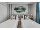 Bright bedroom featuring two twin beds with golf-themed decor and a decorative golf-themed wall mural at 1188 Challenge Dr, Davenport, FL 33896