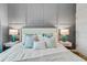 Bright bedroom with a modern upholstered headboard, lamps, and accent pillows at 1188 Challenge Dr, Davenport, FL 33896
