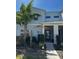 Modern two-story townhome with a decorative brick entryway and well-maintained landscaping at 1188 Challenge Dr, Davenport, FL 33896