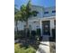 Charming two-story townhome featuring a modern facade and lush landscaping at 1188 Challenge Dr, Davenport, FL 33896