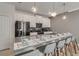 Stylish kitchen featuring a large island with barstool seating and pendant lighting at 1188 Challenge Dr, Davenport, FL 33896