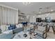 Open-concept living space with kitchen, dining area, and living room, furnished with modern decor at 1188 Challenge Dr, Davenport, FL 33896