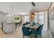 Open-concept living space with a kitchen, living room, and dining area with modern design at 1188 Challenge Dr, Davenport, FL 33896