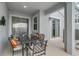 Charming outdoor patio with dining table and chairs, perfect for entertaining and enjoying the view at 1188 Challenge Dr, Davenport, FL 33896