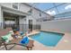 Inviting private pool area with lounge chairs, patio furniture, and a secure safety fence at 1188 Challenge Dr, Davenport, FL 33896