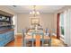 Well-appointed dining room featuring wood floors, natural light, table, and chairs at 1311 Olympia Park Cir, Ocoee, FL 34761