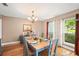 Cozy dining room featuring wood floors, natural light, table and chairs at 1311 Olympia Park Cir, Ocoee, FL 34761