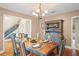 Dining room featuring hardwood floors, natural light, stylish table, and chairs at 1311 Olympia Park Cir, Ocoee, FL 34761