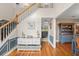 Bright foyer with hardwood floors, staircase, and stylish decor at 1311 Olympia Park Cir, Ocoee, FL 34761