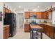 Kitchen featuring stainless steel appliances, granite countertops, and an island for food preparation at 1311 Olympia Park Cir, Ocoee, FL 34761
