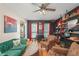 Charming living room with hardwood floors, stylish decor, and large windows at 1311 Olympia Park Cir, Ocoee, FL 34761
