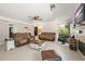 Inviting living room features comfortable seating, tile flooring, a ceiling fan, and a cozy fireplace at 1311 Olympia Park Cir, Ocoee, FL 34761