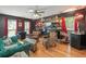 Unique living room with built-in shelves, modern furniture, and hardwood floors at 1311 Olympia Park Cir, Ocoee, FL 34761