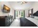 Bright main bedroom with large windows and ceiling fan provides views and natural light at 1311 Olympia Park Cir, Ocoee, FL 34761