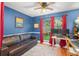 Cozy office space with a comfortable sofa, large window, and hardwood floors at 1311 Olympia Park Cir, Ocoee, FL 34761