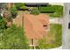 Aerial view of the home showcasing the roof, surrounding trees, and the neighborhood at 1330 Broken Pine Rd, Deltona, FL 32725