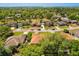 Aerial view of a residential neighborhood with lush green trees and beautiful homes at 1330 Broken Pine Rd, Deltona, FL 32725