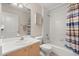 Bright bathroom with a vanity, framed mirror, toilet, and shower-tub combo at 1330 Broken Pine Rd, Deltona, FL 32725