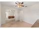 Bedroom with neutral carpet, fan, and mirrored closet at 1330 Broken Pine Rd, Deltona, FL 32725