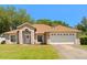 Charming single-story home with a well-manicured lawn and a welcoming front entrance at 1330 Broken Pine Rd, Deltona, FL 32725