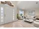 Inviting living room featuring neutral tones, bright light, and comfortable furniture at 1330 Broken Pine Rd, Deltona, FL 32725
