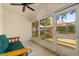 Enclosed sunroom with tiled floors, multiple windows with a view of the fenced backyard at 1330 Broken Pine Rd, Deltona, FL 32725