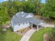 Aerial view of property with a large lot, porte cochere and gray roof at 1417 Olympia Ave, Mount Dora, FL 32757