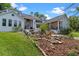 Lush backyard featuring architectural patios and stone landscaping, and attractive plants at 1417 Olympia Ave, Mount Dora, FL 32757