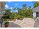 Landscaped backyard featuring a patio with an outdoor seating area at 1417 Olympia Ave, Mount Dora, FL 32757
