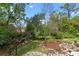 Beautifully landscaped backyard with a tranquil water feature at 1417 Olympia Ave, Mount Dora, FL 32757
