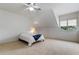 Cozy bedroom with vaulted ceiling and neutral carpet at 1417 Olympia Ave, Mount Dora, FL 32757