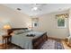 Comfortable bedroom with soft lighting and vintage accents at 1417 Olympia Ave, Mount Dora, FL 32757