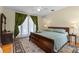 Spacious bedroom featuring elegant decor and hardwood floors at 1417 Olympia Ave, Mount Dora, FL 32757