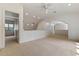 Open bonus room with railing, large window and neutral carpet at 1417 Olympia Ave, Mount Dora, FL 32757