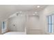 Vaulted bonus room with ceiling fan and natural light at 1417 Olympia Ave, Mount Dora, FL 32757