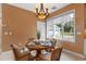 Cozy breakfast nook with chandelier lighting and views of the backyard at 1417 Olympia Ave, Mount Dora, FL 32757